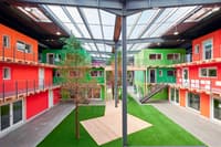 Des modules en bois dans un entrepôt par l'atelier d'architecture Lutz Associés à Fribourg - Image 4